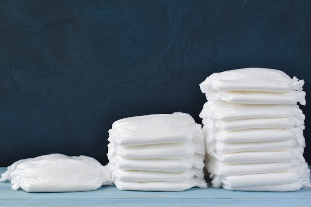 Steps of diaper stacks on a wooden table