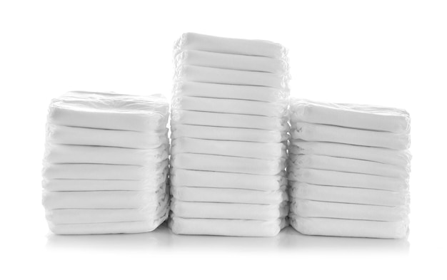 Stack of baby's diapers isolated on white